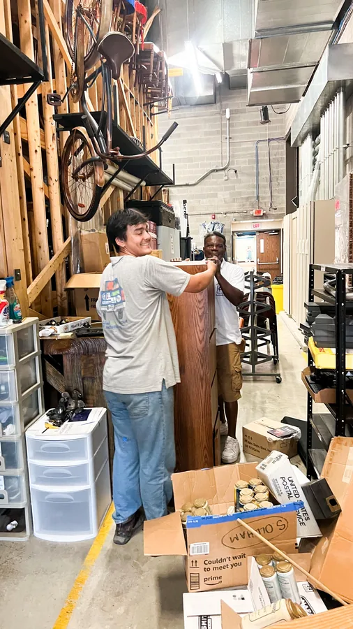 Junkdrop crew organizing a storage area at Nashville Public Television