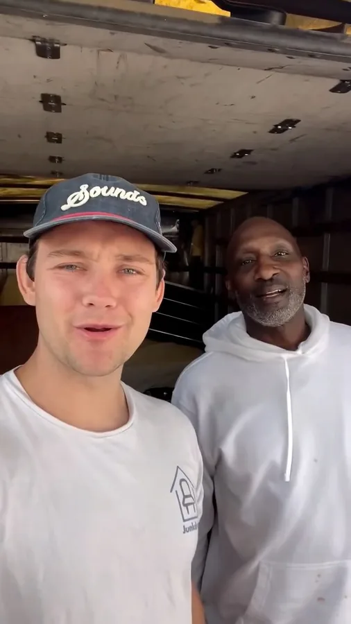 Junkdrop crew beside a truck during a donation delivery