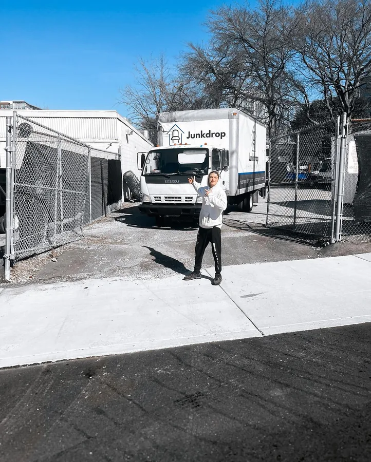 Junkdrop crew and truck on a neighborhood street