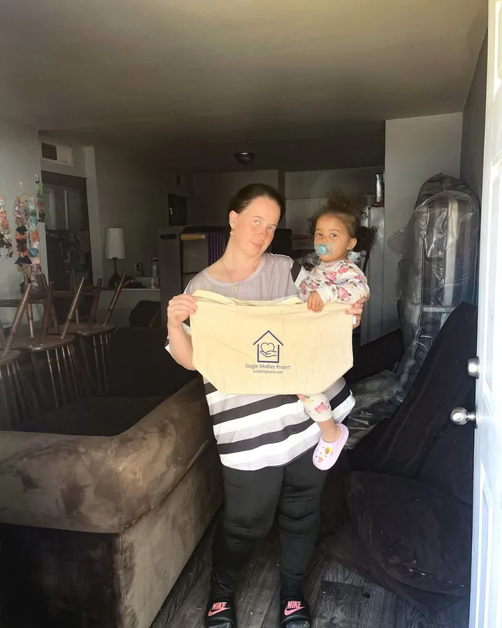 Family receiving a box of household goods through Junkdrop
