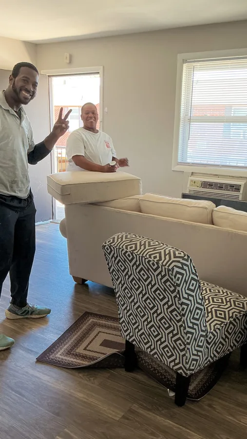 Junkdrop crew with furniture inside a room