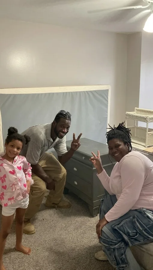 Junkdrop crew delivering furniture inside a home
